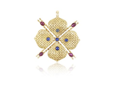 A Ruby and sapphire pendantOf stylised flowerhead design and quatrefoil form, centrally set with a cabochon-cut sapphire, eac