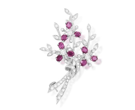 A Diamond and ruby spray broochDesigned as a bouquet, with oval, mixed-cut rubies as petals, highlighted with diamonds, mount