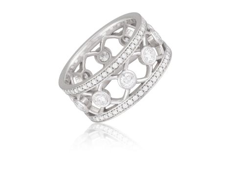 A Diamond dress ringThe brilliant-cut diamonds, collet-set within open latticework design, bordered by pavé-set diamonds, mou