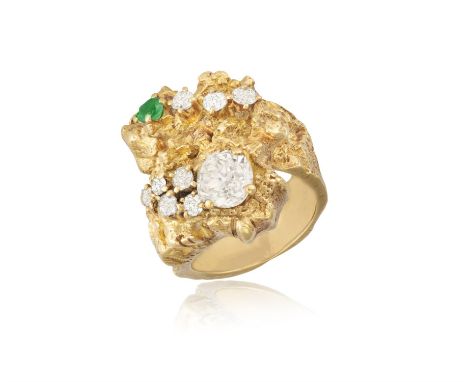 A Diamond and emerald ringThe old-cut diamond highlighted with eight smaller old-cut diamonds and a round, mixed-cut emerald,