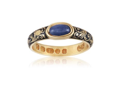 A Victorian sapphire and enamel ringThe oval, cabochon-cut sapphire, bezel-set, the shank with chased, foliate and floral dec