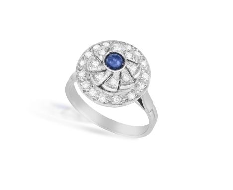 A Sapphire and diamond target ringThe cabochon-cut sapphire within a single-cut diamond surround, total estimated diamond wei