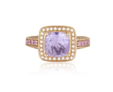 An Amethyst, diamond and pink sapphire cluster ringThe cushion-shaped amethyst within a pavé-set diamond surround, with pink 