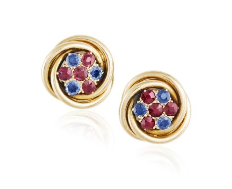 A Pair of ruby and sapphire earringsEach centering a flowerhead motif, set with cushion-shaped and circular-cut rubies and sa