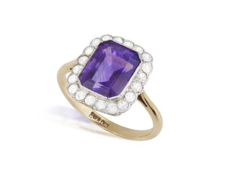 An Amethyst and diamond cluster ringThe octagonal step-cut amethyst within a single and brilliant-cut diamond surround, colle