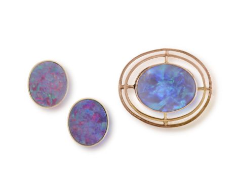 Two Items of black opal jewelleryIncluding: an oval, cabochon-cut black opal set target brooch, mounted in 9ct gold, length c