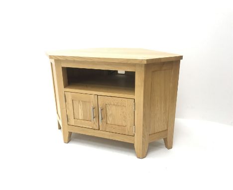 Light oak corner television stand, single shelf above two cupboard doors, stile supports - Condition Report 