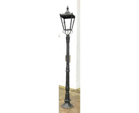 Victorian style black painted cast iron street lamp, tapering lantern with pointed finials, on stepped hexagonal base, H319cm