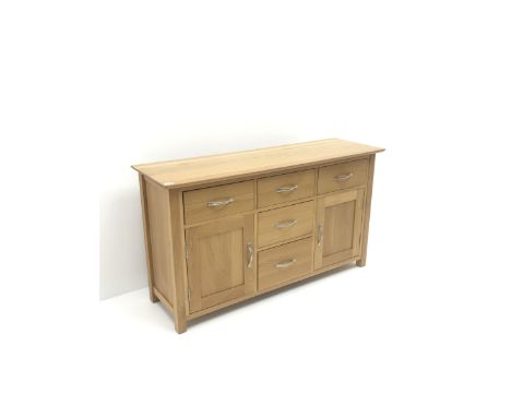 Light oak sideboard, five drawers and two cupboards, stile supports - Condition Report 