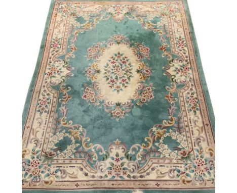 Large Chinese wash woollen turquoise ground rug carpet, 358cm x 255cm - Condition Report Bad patch of wear to one end. Severa