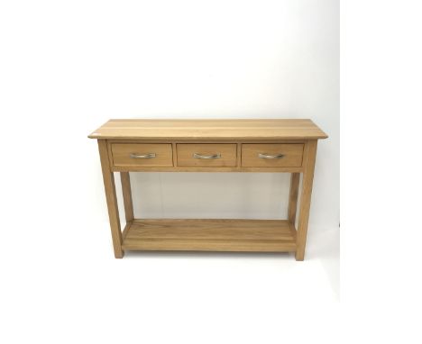 Light oak side console table, three drawers, square supports joined by solid undertier - Condition Report 