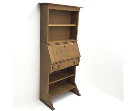 Early 20th century oak secretaire bookcase, projecting cornice above single shelf, fall front, single drawer, shaped solid en