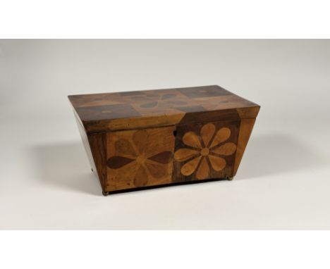 A large specimen wood inlaid tea caddy, second quarter of the 19th century, of sarcophagus form, the cover and sides with geo