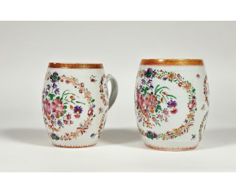 A graduated pair of Chinese Export famille rose porcelain mugs, c. 1800, of barrel form, decorated with floral roundels enclo