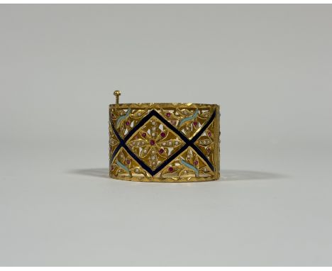A striking hinged yellow metal bangle (possibly high carat gold, unmarked and untested), trellis-pierced and decorated with d