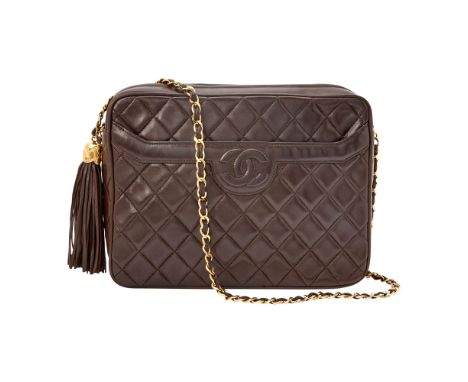 Zip top bag with tassel zipper pull, stitched double 'CC' on front slip pocket, gold-tone hardware and woven-in leather chain