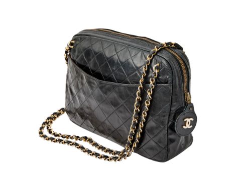 Black leather with double 'CC' zipper pull and woven-in leather chain strap, two side slip pockets, burgundy leather interior