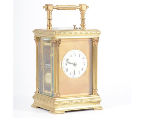 French brass cased repeating carriage clock, case with Corinthian columns, ivorine face, within a gilt slip platform escapeme