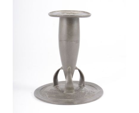 Archibald Knox for Liberty &amp; Co. a Tudric pewter candlestick, circa 1900, flared sconce on tapering column supported by t