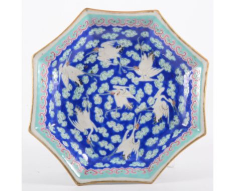 Chinese polychrome octagonal shape footed dish, bearing Tongzhi six-character seal mark, decorated with seven cranes against 