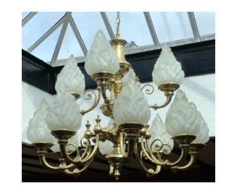 Brass two tier twelve light chandelier, scrolled branches, issuing from a knopped and ringed column, 90cm drop, diameter 95cm