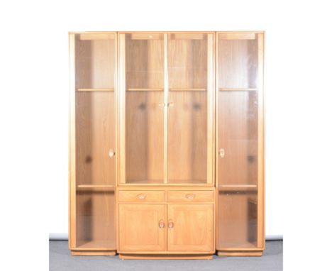 Ercol, a large 4-section Windsor display cabinet, with upper central glazed display case above a cabinet section with two dra