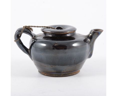 Small Chinese stoneware black glazed teapot, probably late Qing, compressed circular form, black glazed over brown, 6cm.