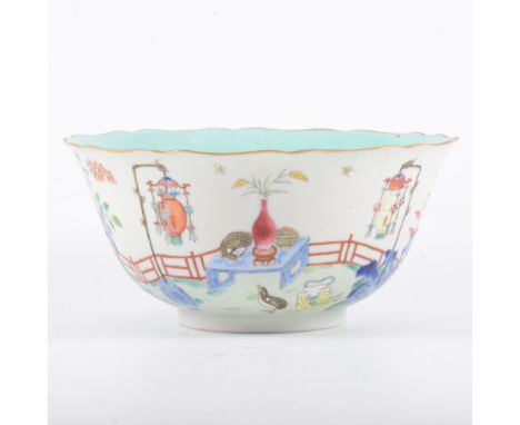 Chinese polychrome bowl, bearing six-character seal mark, painted with a fenced garden scene, incorporating rocks, table, two