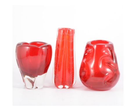 Whitefriars, a 'Knobbly' glass vase, cased ruby, 14.5cm; a lobed controlled bubble vase 18.5cm; and another lobed vase, 16cm.