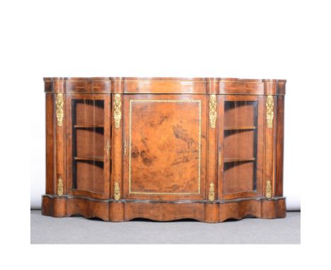 Victorian figured walnut, walnut marquetry and gilt metal mounted serpentine credenza, maskhead appliques, centre closed pane