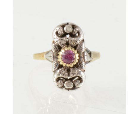 A ruby and diamond scroll design dress ring, a central ruby claw set in yellow metal with six rose cut diamonds set into the 