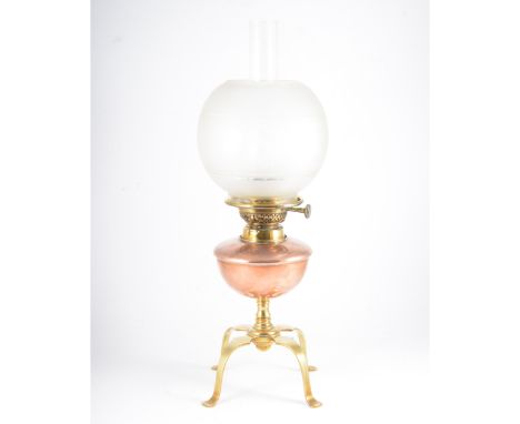 W.A.S Benson, an Art Nouveau brass and copper oil lamp, fitted with an Evered &amp; Co patent taper housing, the copper reser