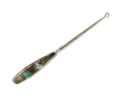 Liberty &amp; Co., a Cymric silver and enamelled button hook, Birmingham, 1904, the silver handle with enamelled Celtic knots