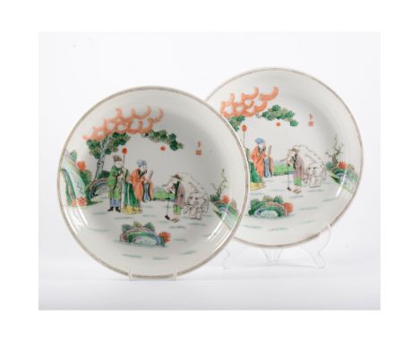 Pair of Chinese famille rose shallow dishes, each bearing six-character seal mark, designed with figures and an elephant, in 