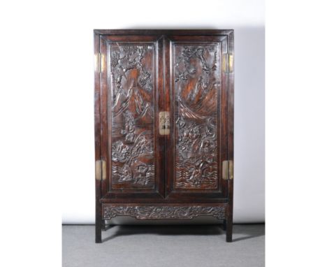 Chinese hardwood cabinet, two carved panelled doors enclosing shelves, and two internal drawers, carved and shaped apron-piec