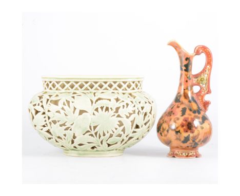 Zsolnay Pecs, a pottery ewer and reticulated planter, early 20th century, the ewer painted with Islamic style floral design, 