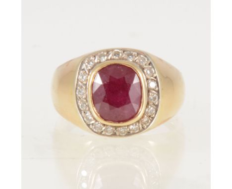 A ruby and diamond signet style ring, the cushion shaped ruby 9mm x 7mm collet set and surrounded by eighteen brilliant cut d
