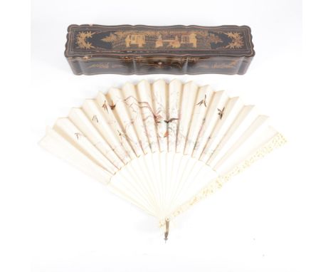 A Cantonese carved ivory and embroidered silk fan, circa.1900, designed with exotic birds and flowers, sticks carved in tradi