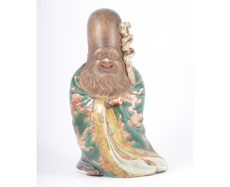 Chinese stoneware figure of Shou Lao, probably Republican period, carrying a scroll and staff, painted in coloured enamels, 2