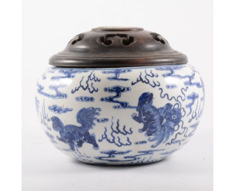 Chinese blue and white bowl, bearing Kangxi six-character mark, decorated with playing lions and cloud motifs, hairline crack