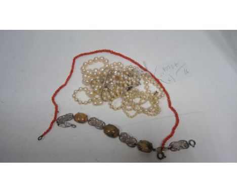 A white metal and moss agate cabochon bracelet; seed pearl necklace; cultured pearl necklace; coral necklace; and other jewel