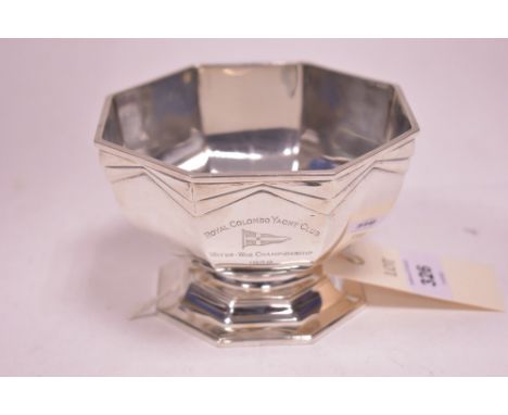 An octagonal silver sugar bowl, by Goldsmiths and Silversmiths Co, London 1938, with Art Deco design to border, Royal Cambo Y