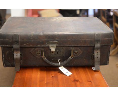 An antique brown leather travelling trunk by J.C. Sweeney of Newcastle.