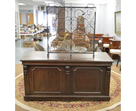 A large Victorian oak silver chest, the rectangular plank top opening to a baize lined interior, panelled front and sides, ca