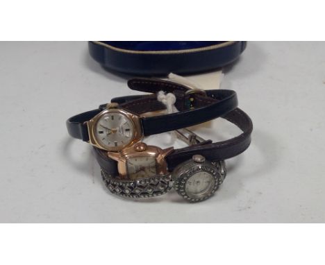 Two 9ct yellow gold cased lady's cocktail watches, one by Accurist, the other by Rotary; and a marcasite set cocktail watch.