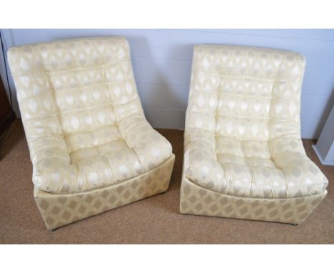 Four 1960's button upholstered designer lounge chairs.
