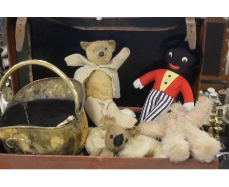 A vintage leather suitcase containing vintage teddys, makers to include Wendy Boston and Chad Valley; a Golly doll; and a bra