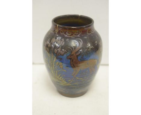 A Pilkingtons Royal Lancastrian lustre vase by Richard Joyce, circa 1915, decorated with three stags and stylized growing flo