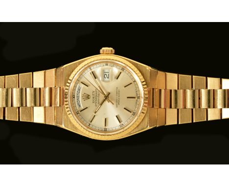 A Gentleman's 1970's Rolex Oysterquartz Day Date Wristwatch the silvered dial with hourly applied gold baton markers, minute 