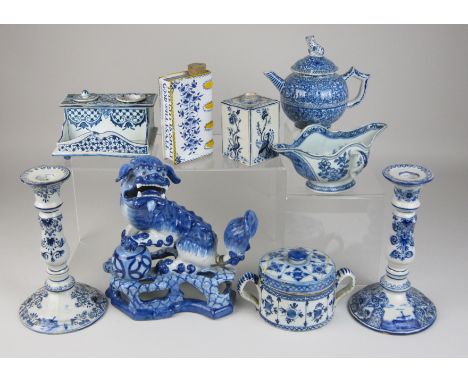 A mixed group of blue and white Delft Items, including an 18th Century Dutch drum posset pot and cover, two Dutch candlestick